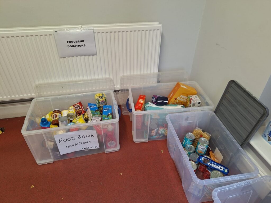Three boxes filled with various food items to be donated to our local food bank